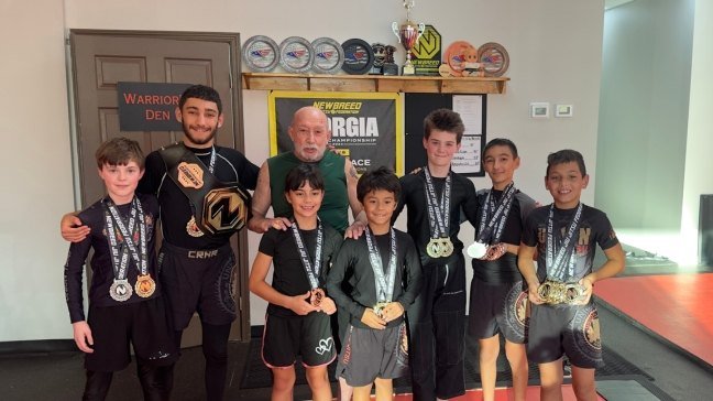 Union Team BJJ youth competitors displaying medals