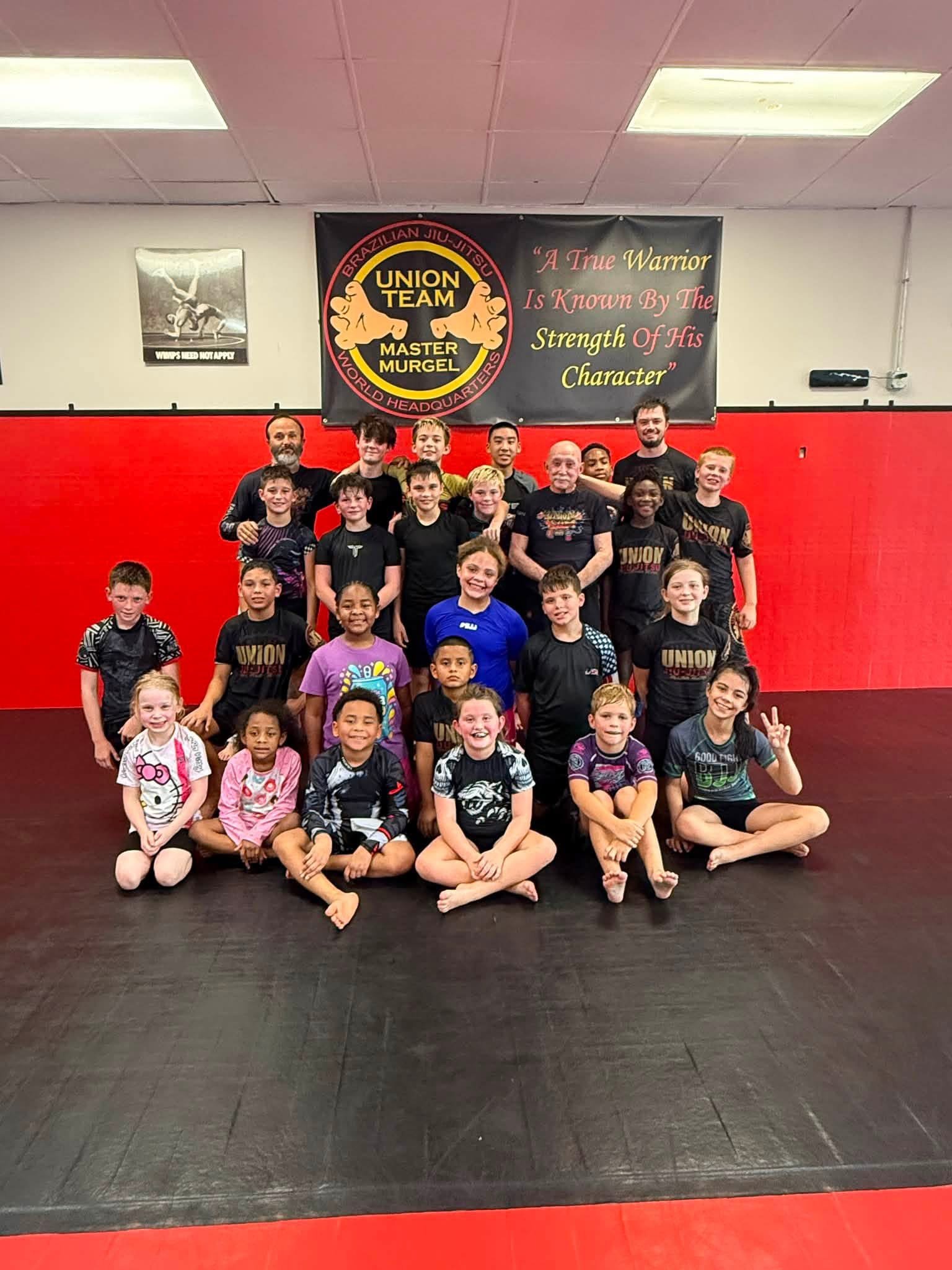Union Team BJJ kids and coaches together at the Alpharetta academy
